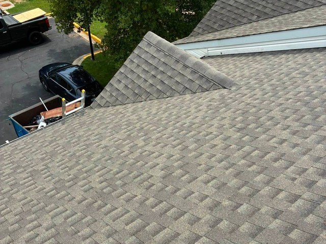 Aerial view of a completed roof replacement job site in Glen Burnie, MD
