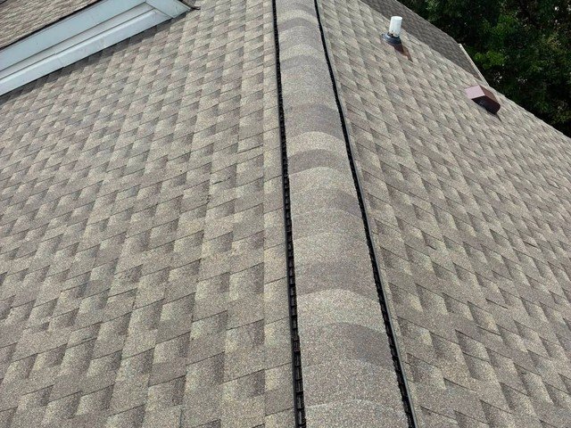 Close-up of new ridge cap and ridge vent installation in Glen Burnie