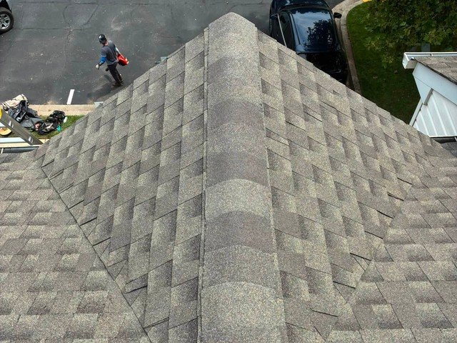 Magothy Roofing and Exteriors crew working on a roof replacement job site in Glen Burnie